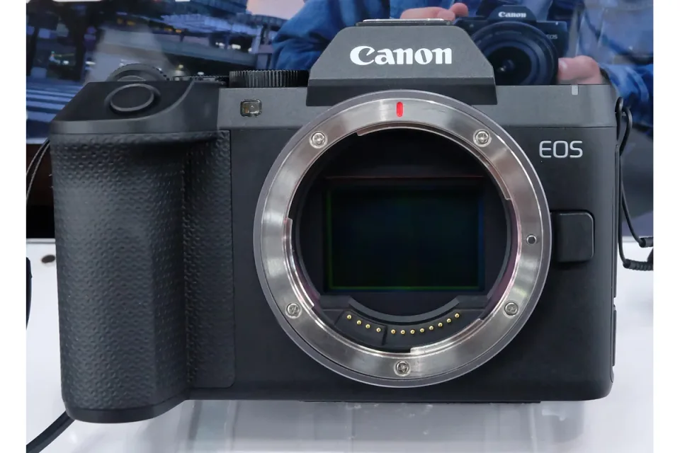 Canon EOS R8 Mark II body photographed without a lens on a store display