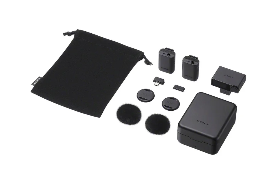 Sony ECM-W5 press photograph showing two transmitters, receiver, charging case and supplied accessories